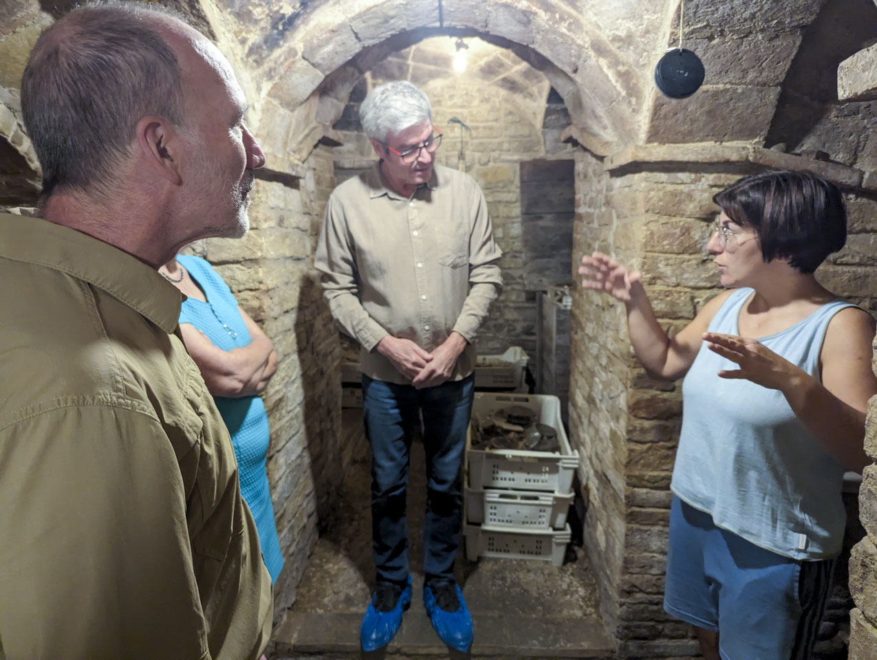 Four people in the cheese cellar