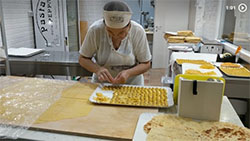 Picture link to video of woman making capaletti like a magician