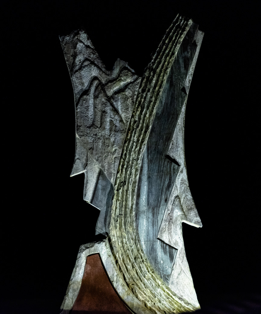 Statue on lawn at night
