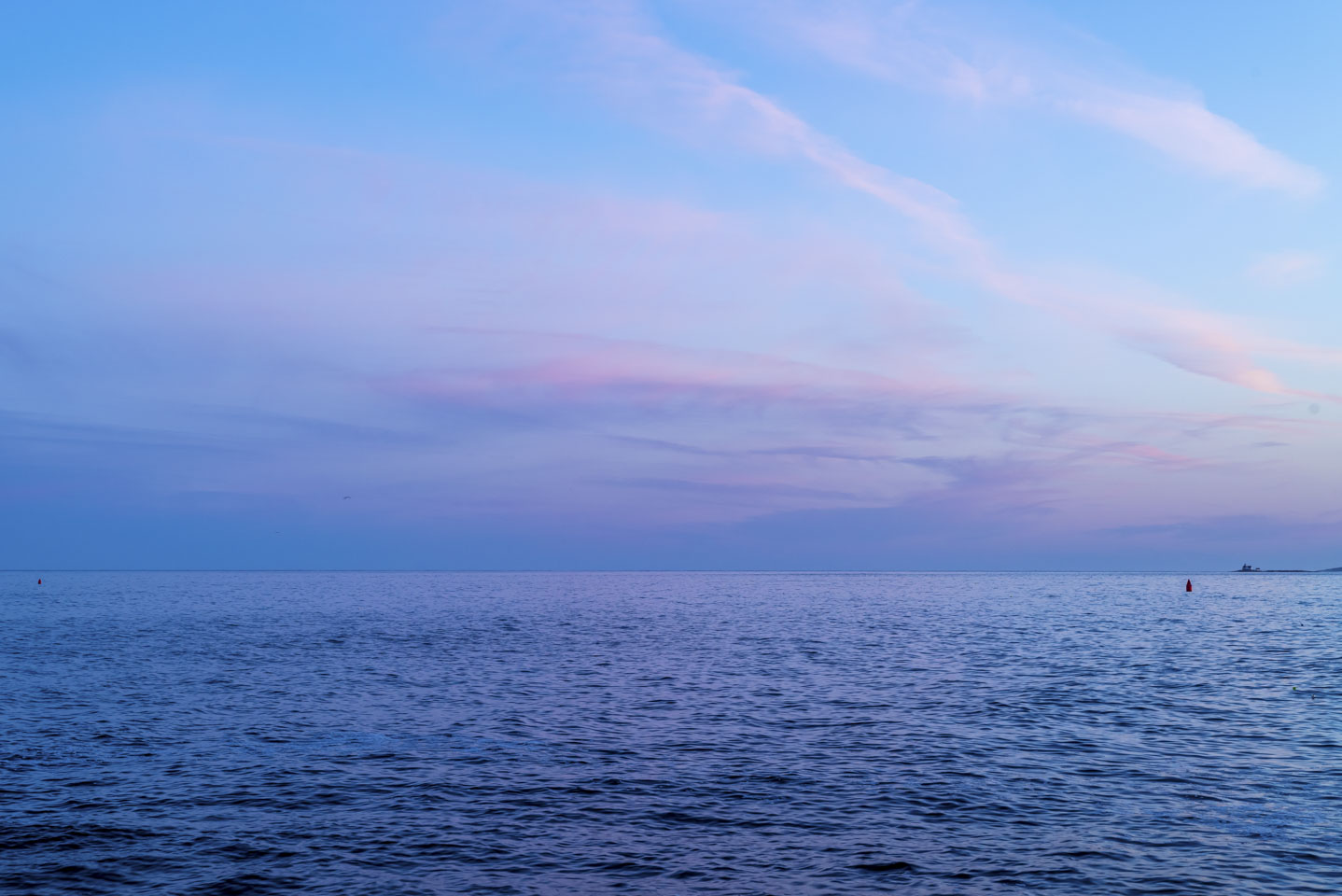 blue and pink colors in the sky before sunset