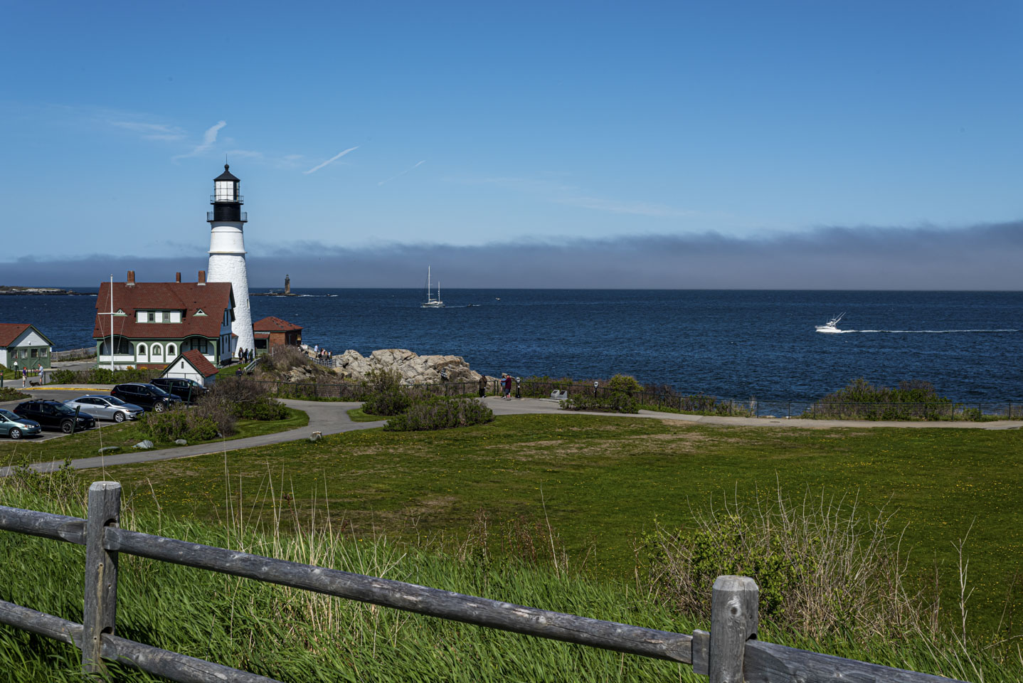Portland Head Light with two boats coming into the channel