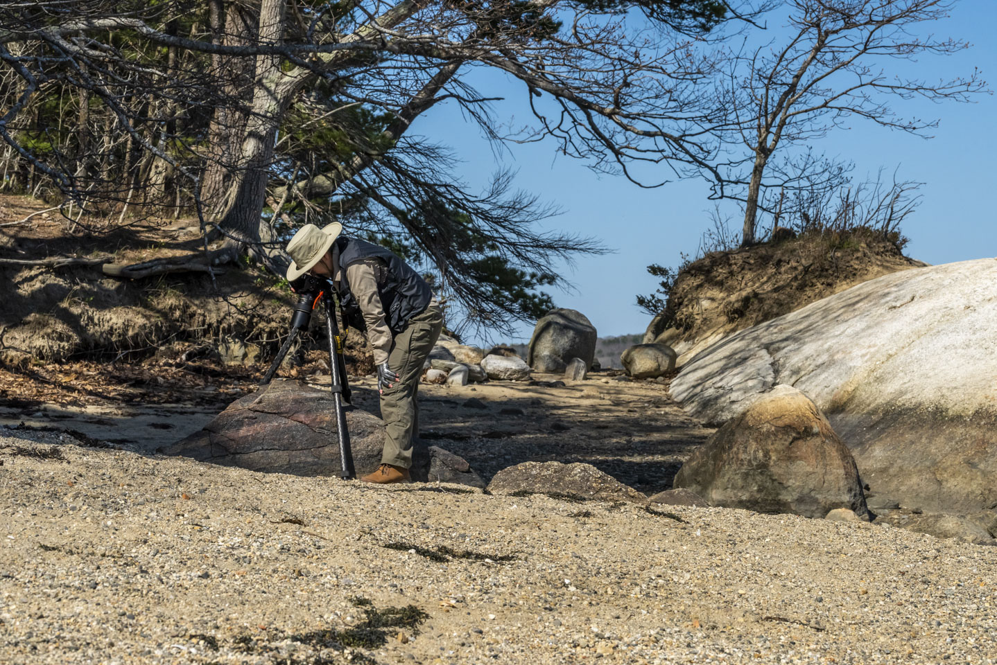 Anne photographing the stone on a larger rock