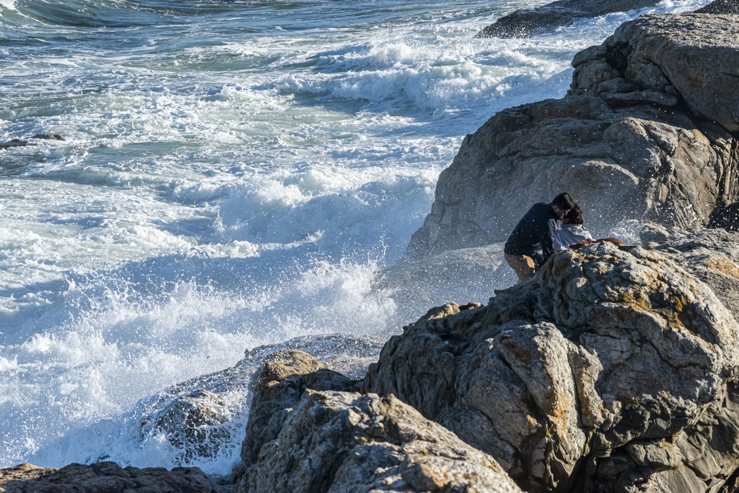People getting splashed by waves at Pemaquid