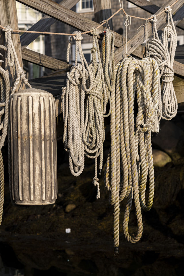 Ropes and a boat bumper hanging off a ramp