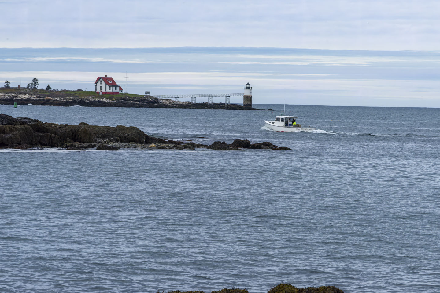 Ram Island Lighthouse and the lobster boat Mrs. Smith