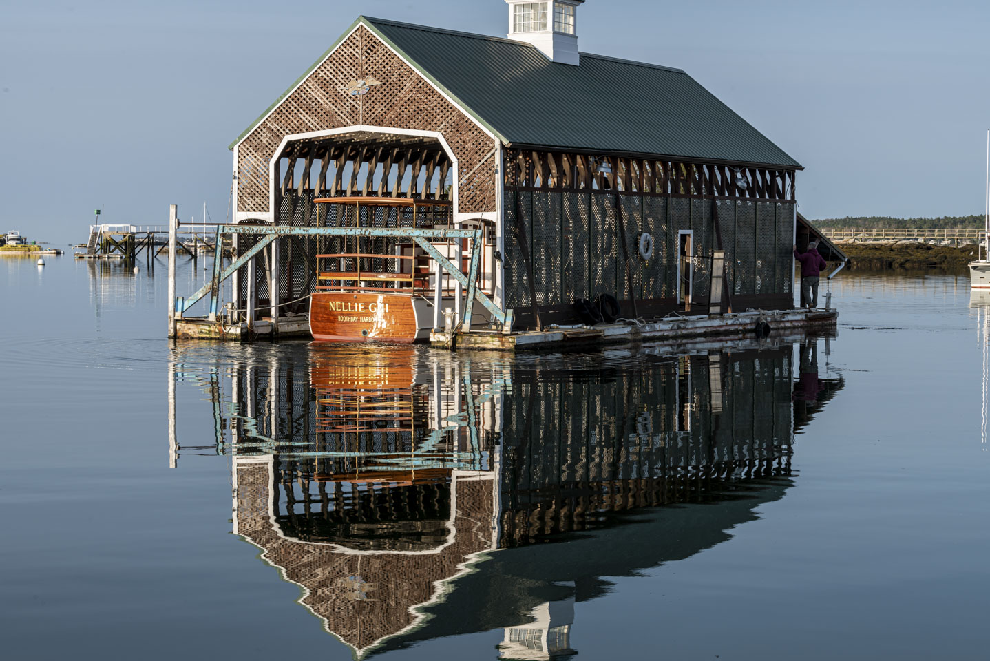 A boat in a shelter, moving across the harbor