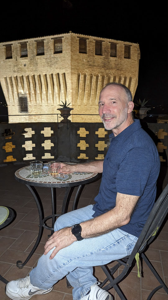 Paul sitting on the terrace of our Mondavio rental, after sunset
