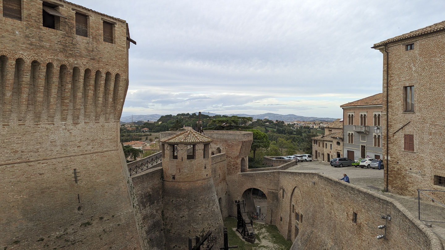 View from the Airbnb of a city plaza and the countryside