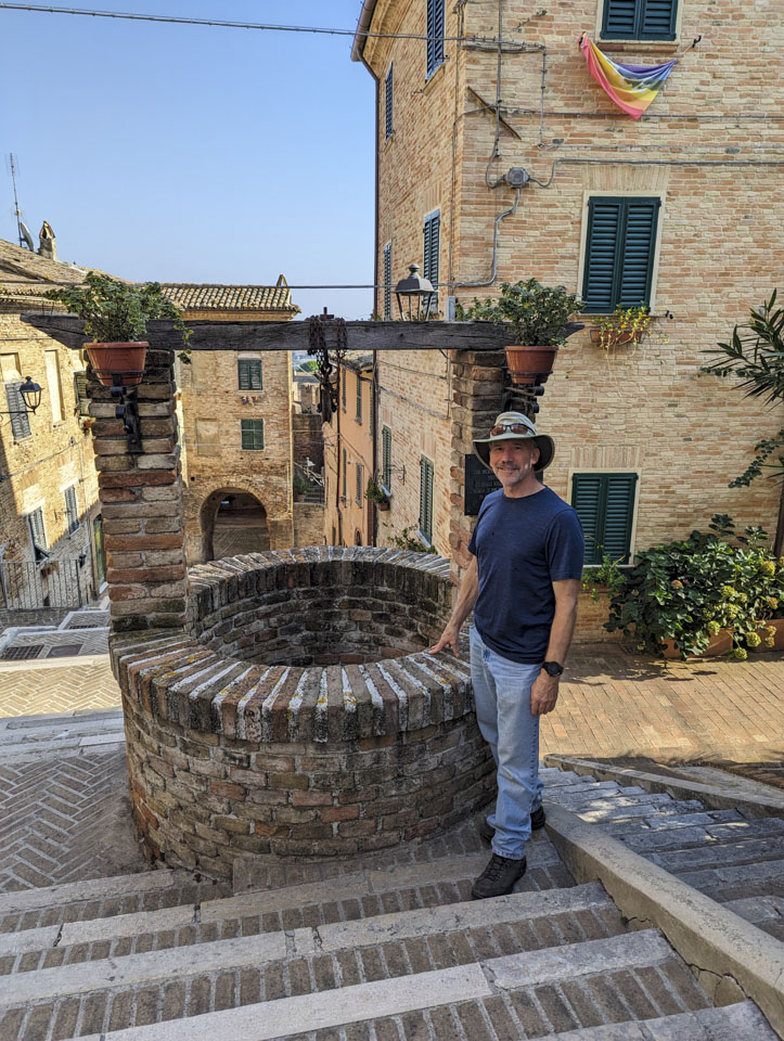 Paul next to the well in Corinaldo
