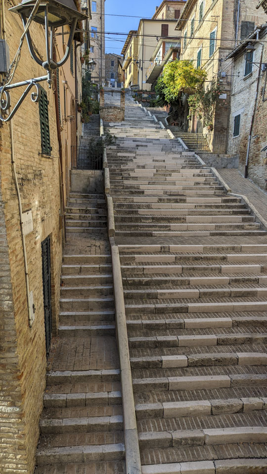 The central staircase in Corinaldo Italy, with the polenta well visible
