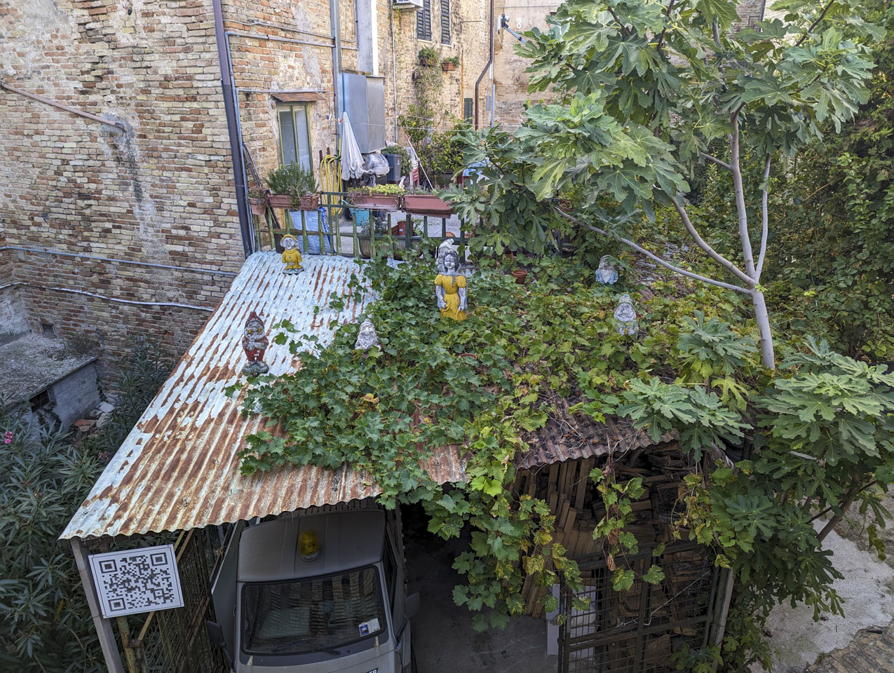 Metal carport roof with little statues of Snow White and the 7 Dwarves