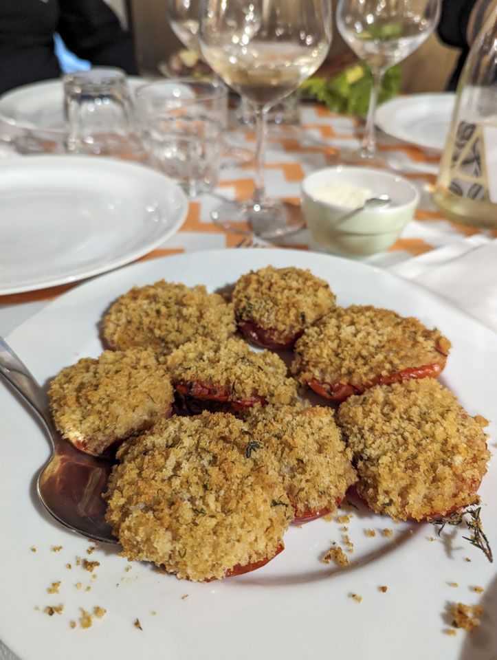 A plate of bread-topped tomatoes