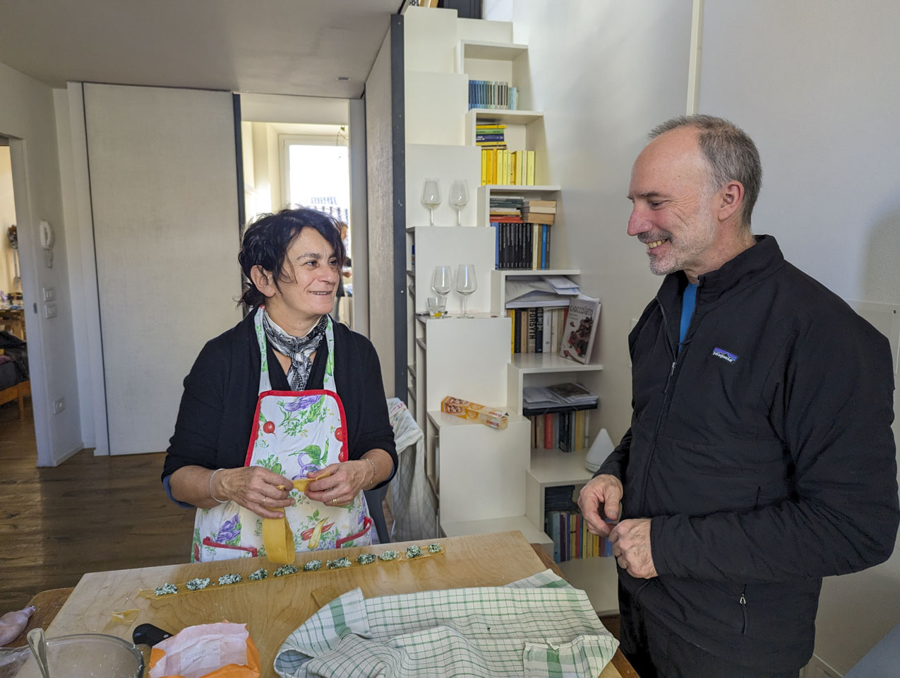 Doni and Paul  at a pasta board with ravioli in process of being made.