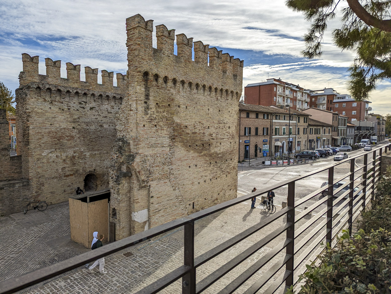 Two tall walls set roughly 25 feet apart that were once the walls of the city entrance.