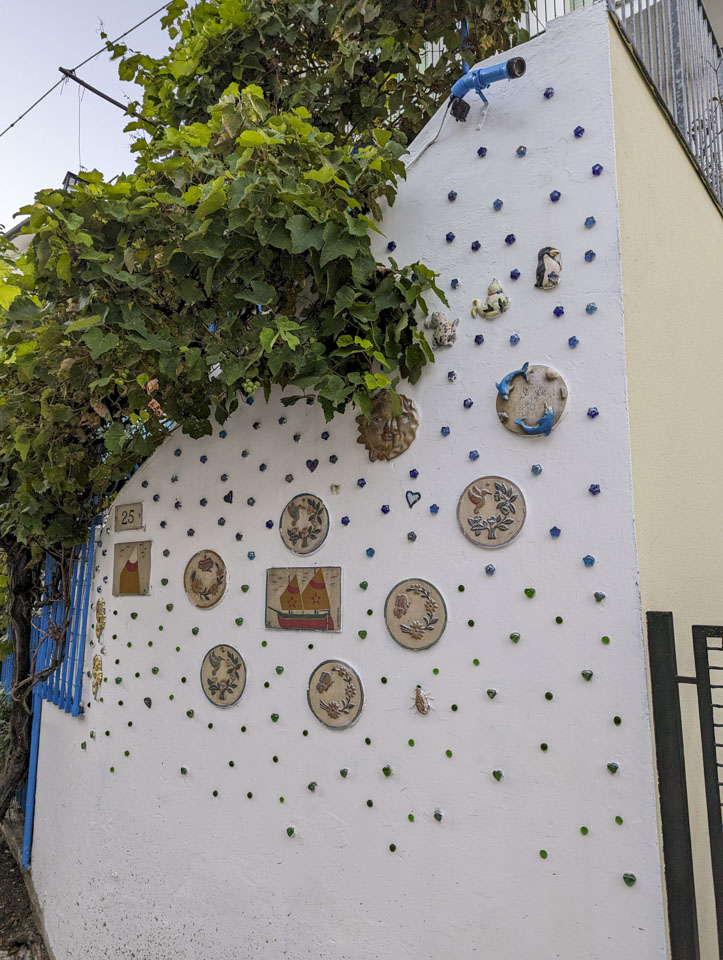 Decorations on a wall with gren vines.