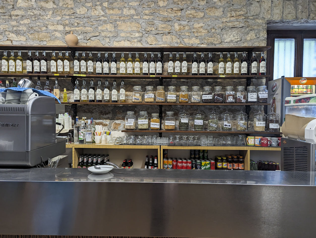 The shelves of the bar at Fonte Avellana