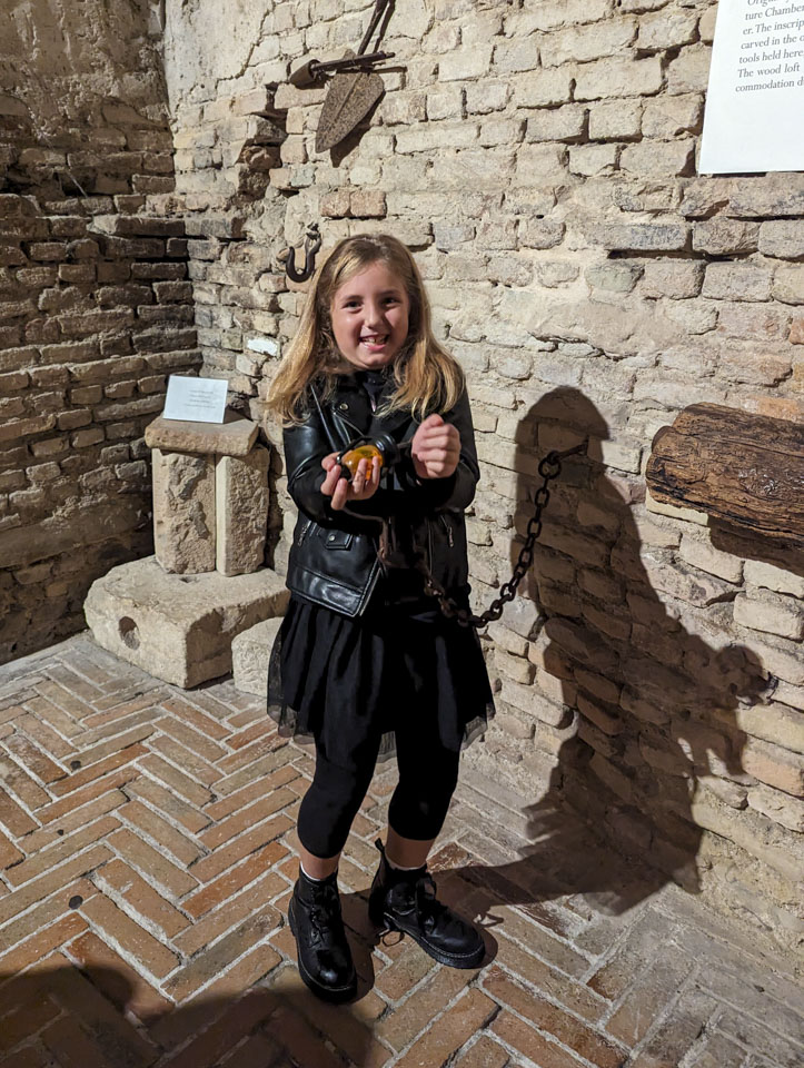 Gulia with a chain and manacles