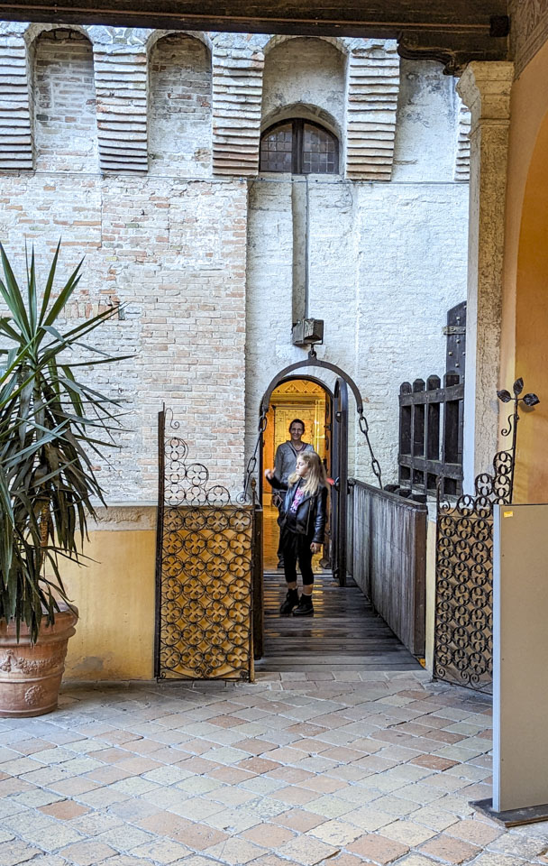Giulia on a bridge walkway with Anne behind her
