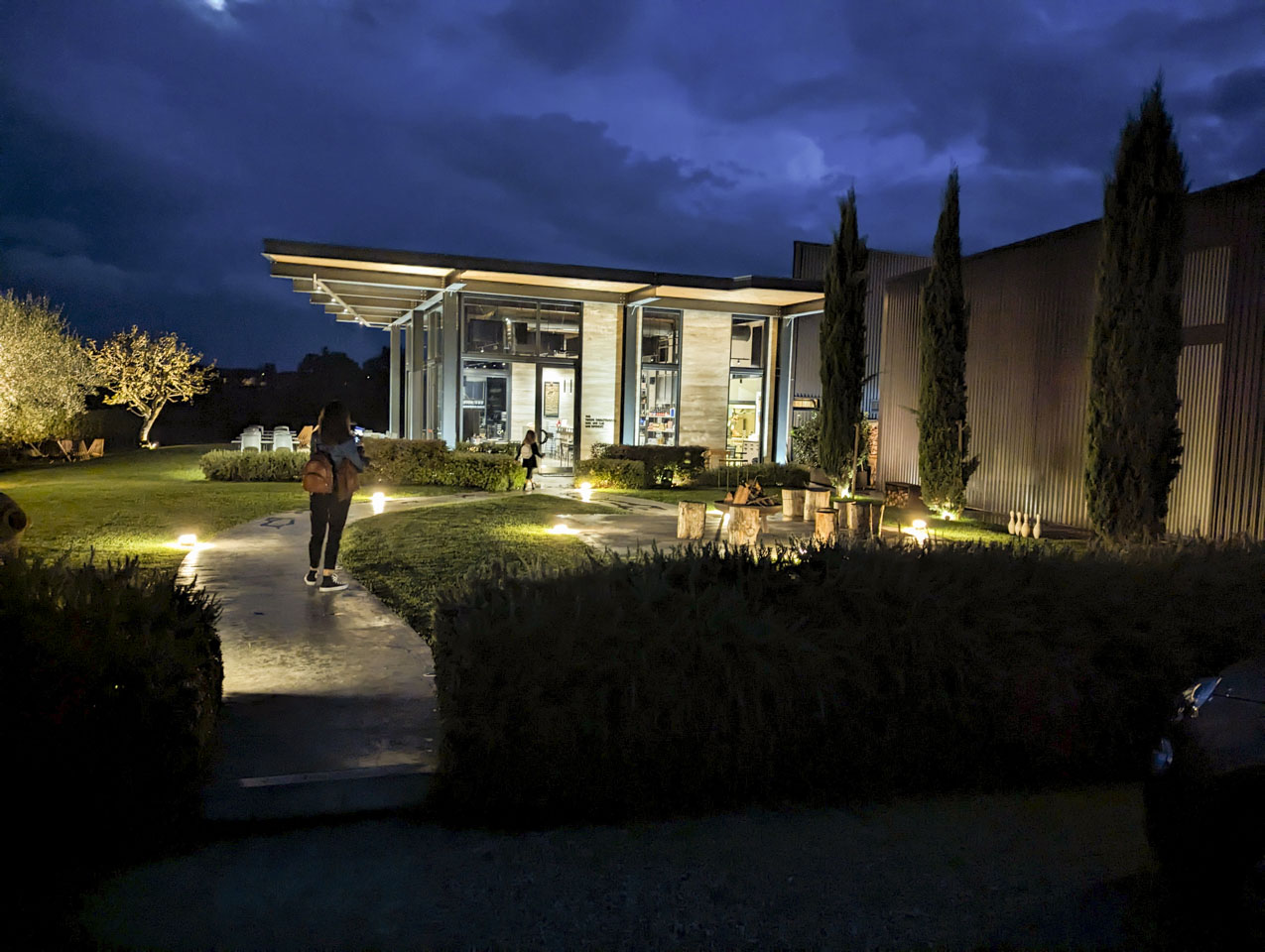 Anio Ottaviani Cantina seen in the evening light, with Valentina and Giulia walking towards it