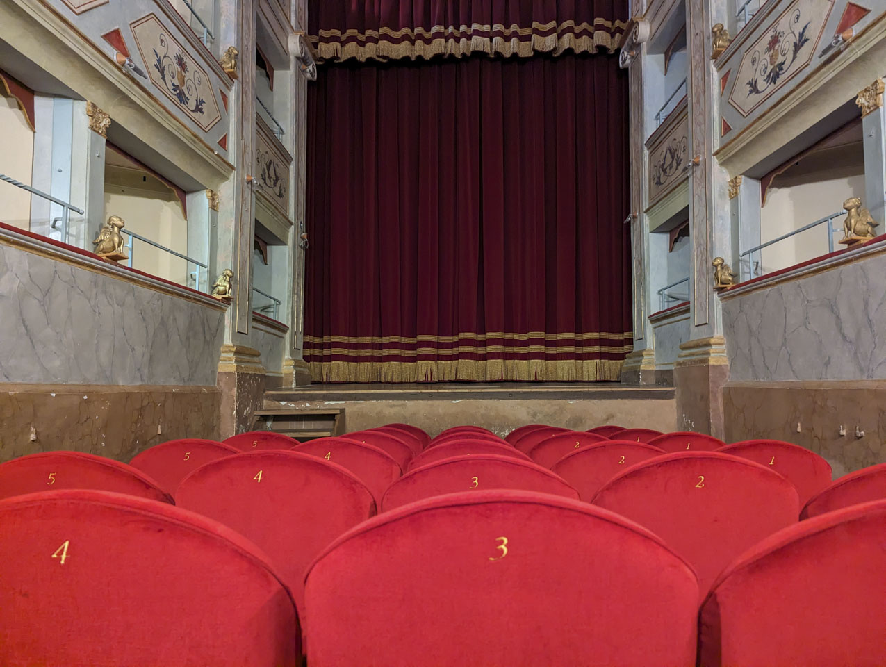 View at eye level of someone sitting in a chair in the theater