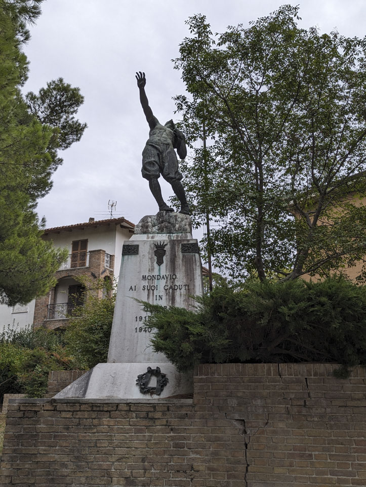 Memorial to those who fell in war. A statue of a man falling
