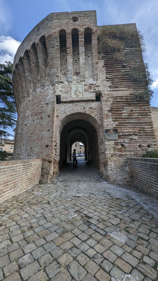 Anne inside an arched tunnel at the end of a ramp. A post to prevent cards from going that way can be seen behind her.