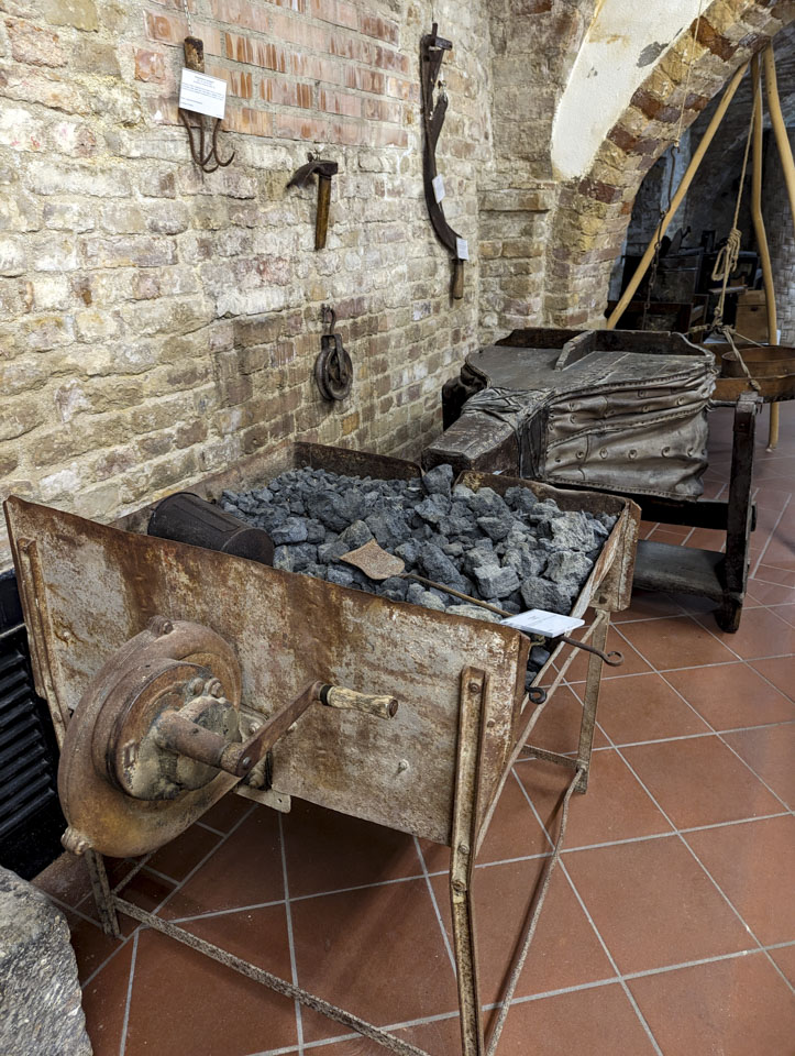 coal and bellows of a rustic forge