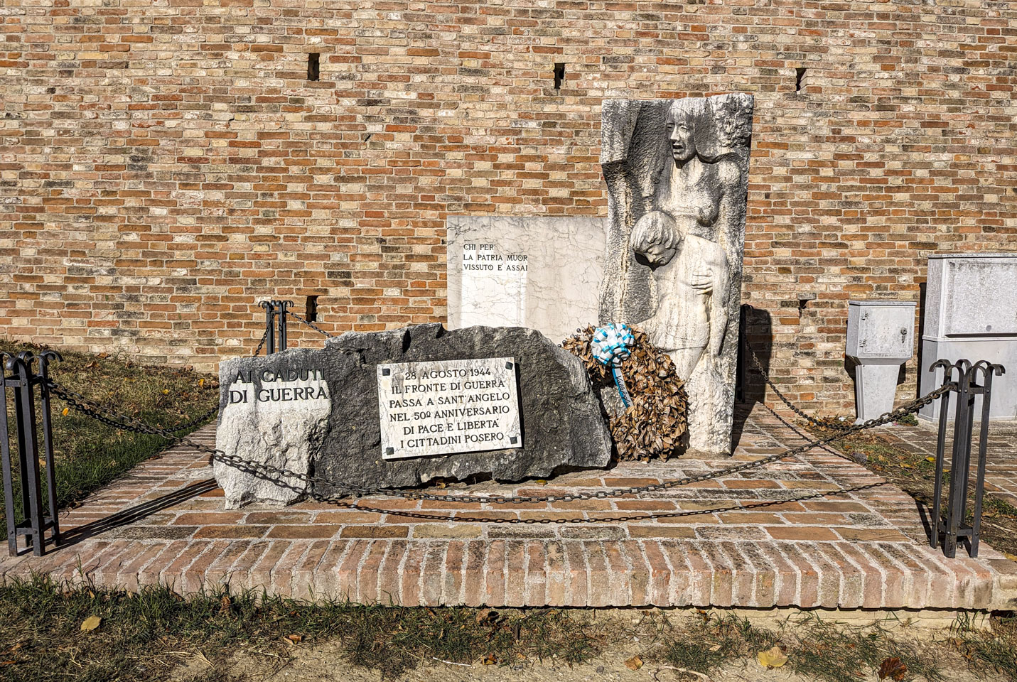 A monument to those who died in war, with a woman, possibly a mother, holding a dead man.