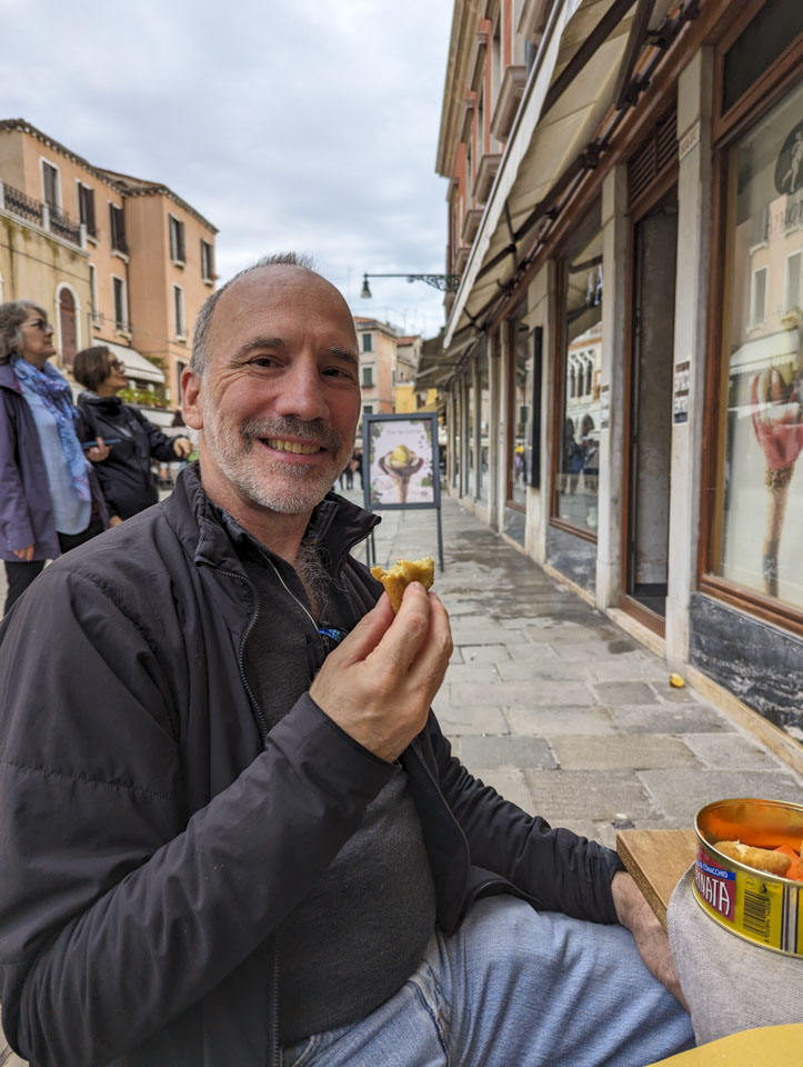 Paul trying a cicchetti, fried ball style
