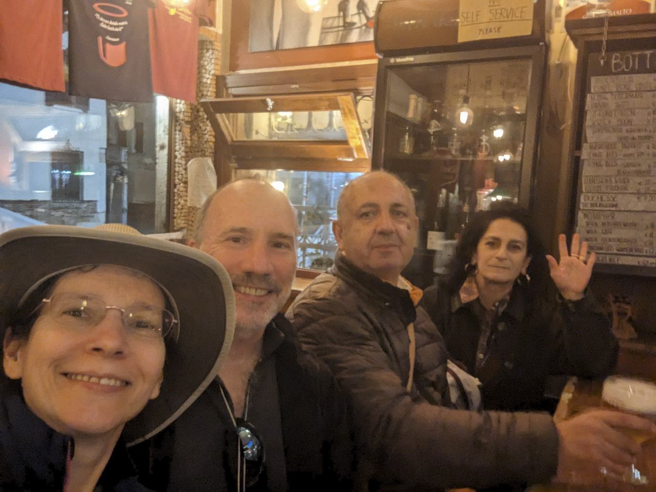 Anne, Paul, Francesco, Doni at a beer pub in Venice, Italy