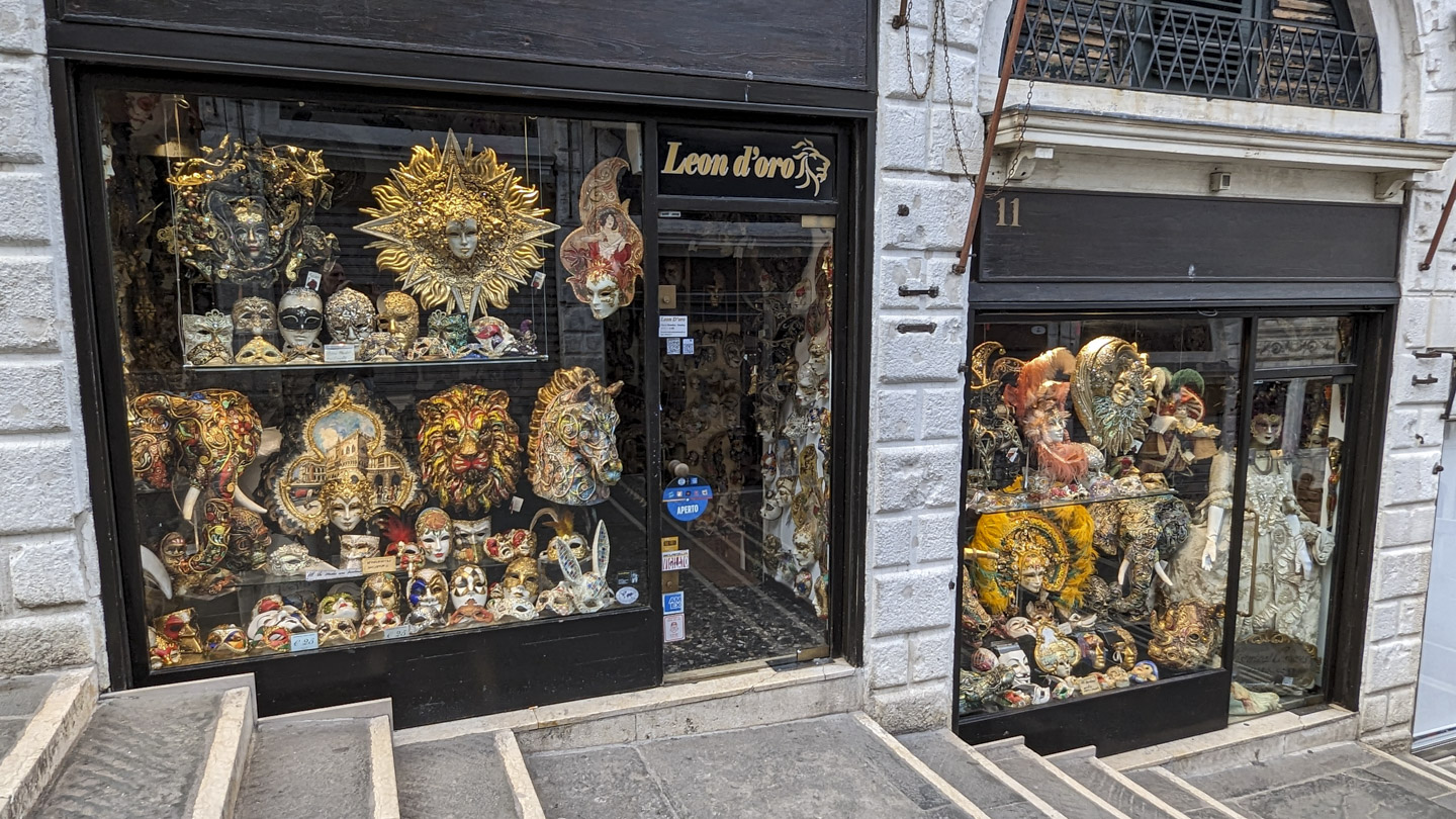 The window of Leon d'oro shop with many different types of masks on display