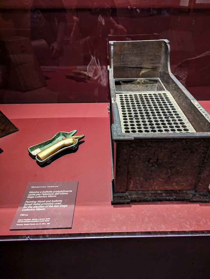 A box with many small holes for little balls.