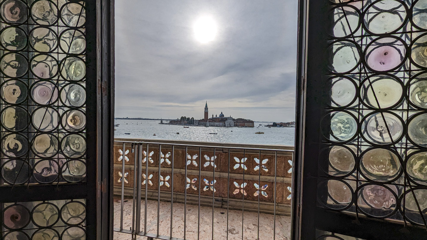 Colored glass windows on each side with an island in view.