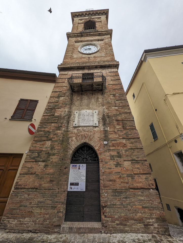 Looking up at a clock tower