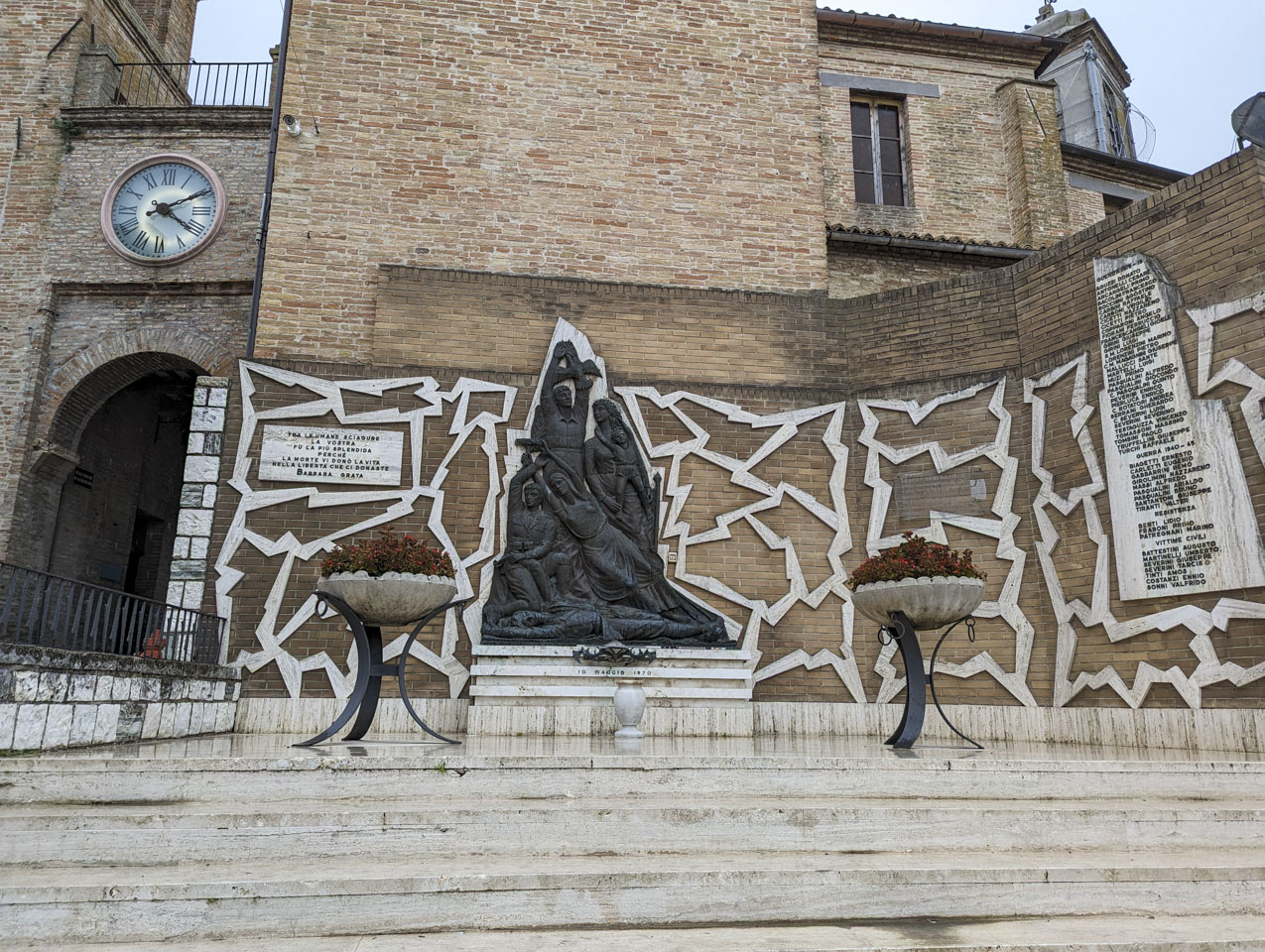 Memorial to those lost in war: One person lying in the ground, with others rising to the heavens above him