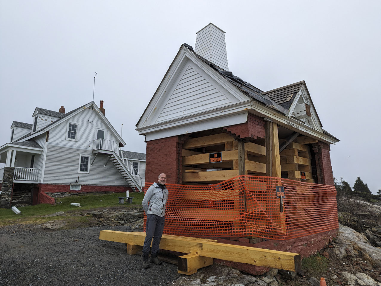 Paul stands next to the remnants of the brick bell house at Pemaquid Point.