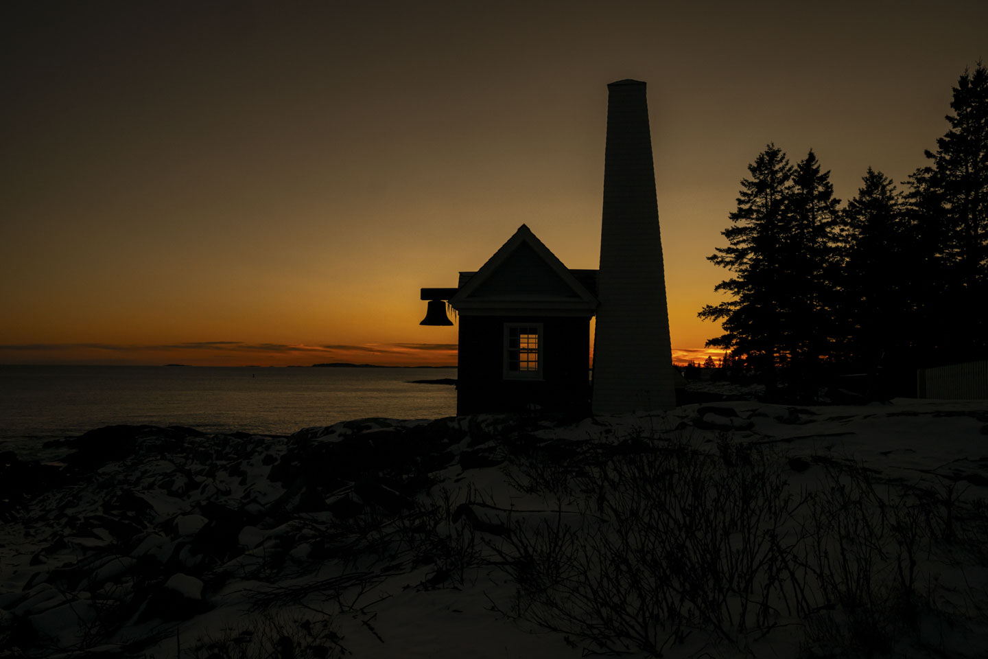 The Pemaquid bell house stands against the last light of the day.