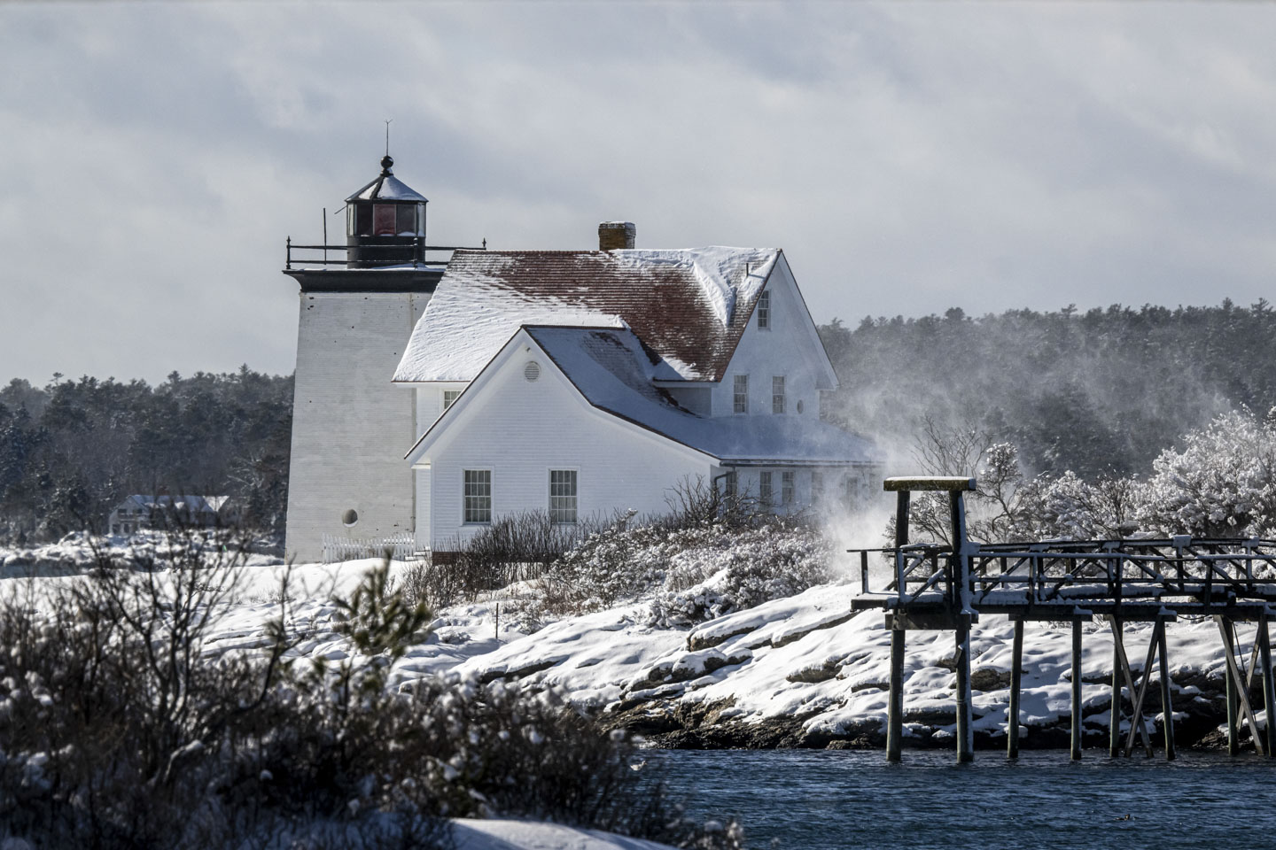 Hendricks Head Lighthouse has windswept snow.