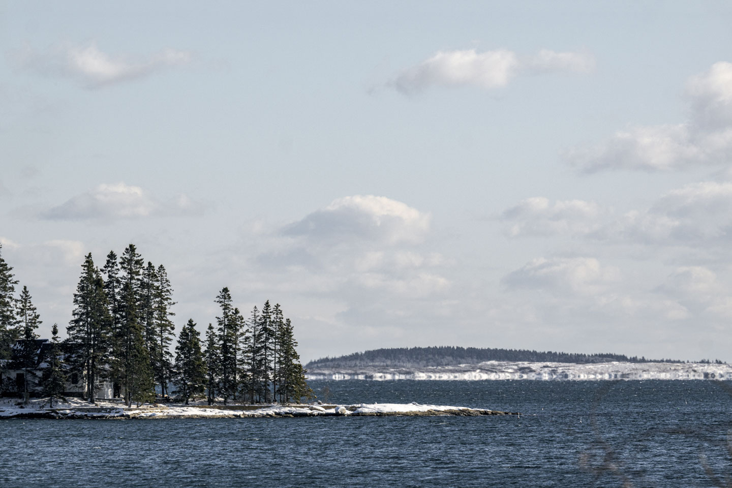 Water with some snow-covered islands.