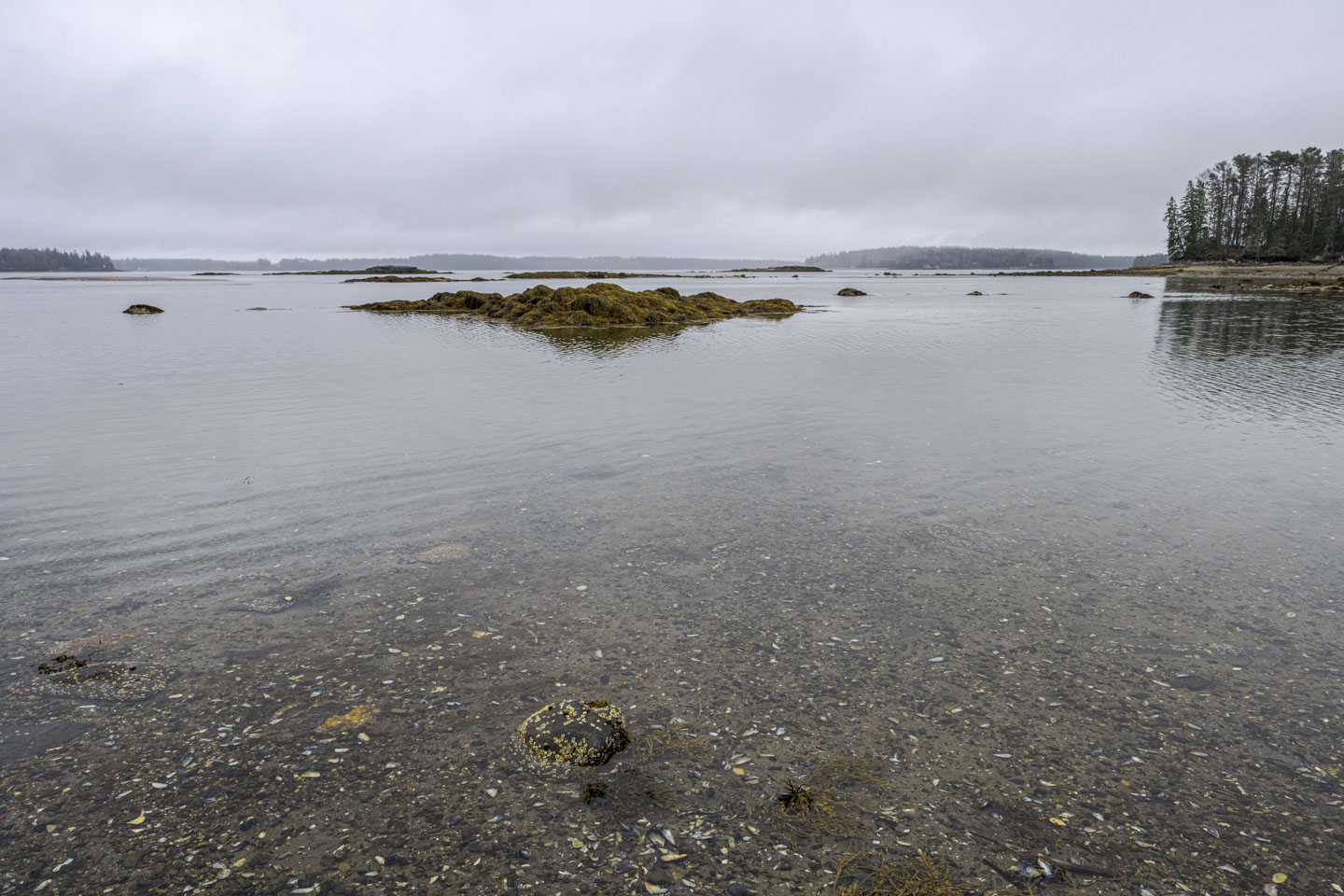 Small groups of rock dot the surface of the water.