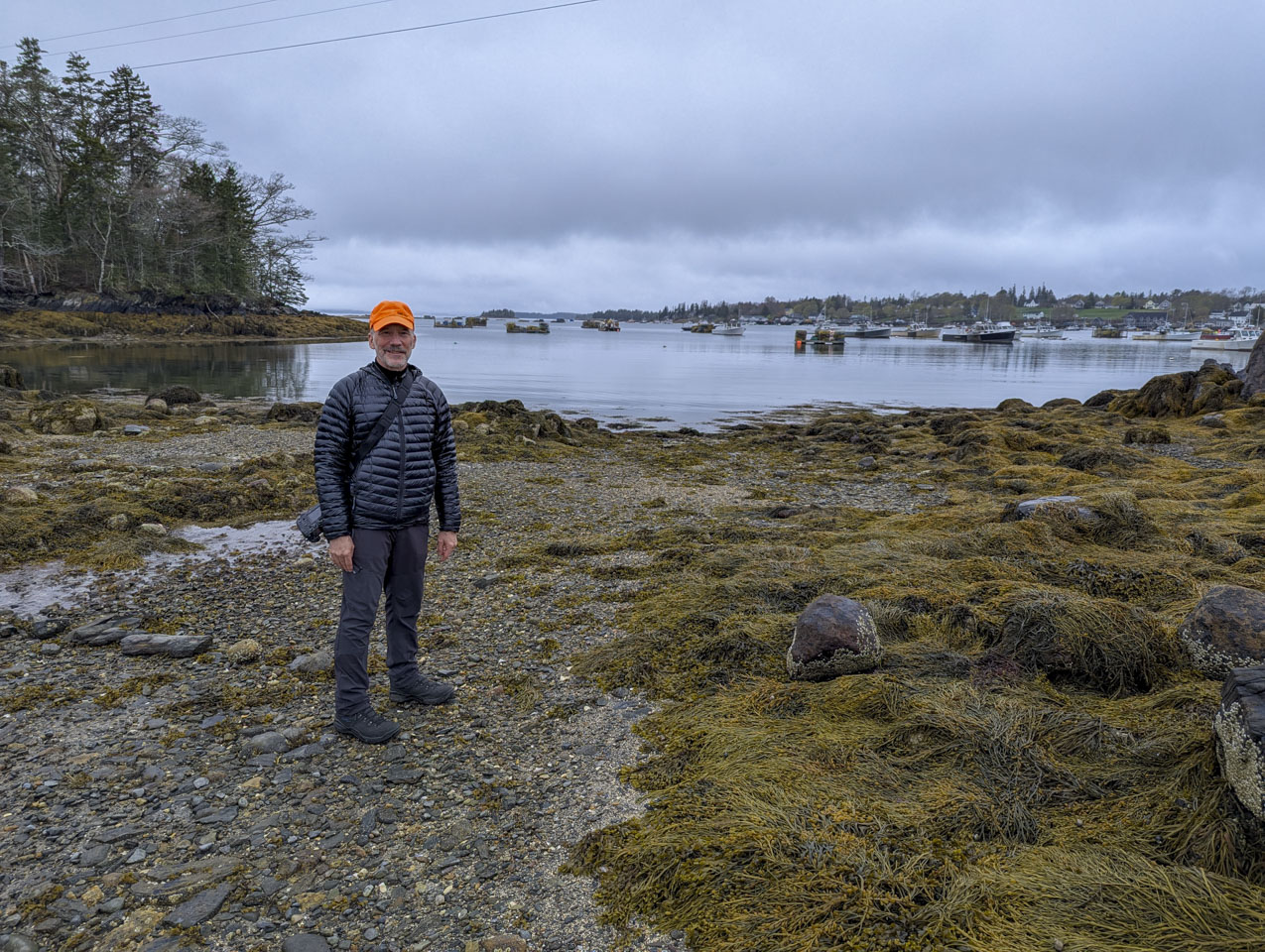 Paul stands in front of the harbor.