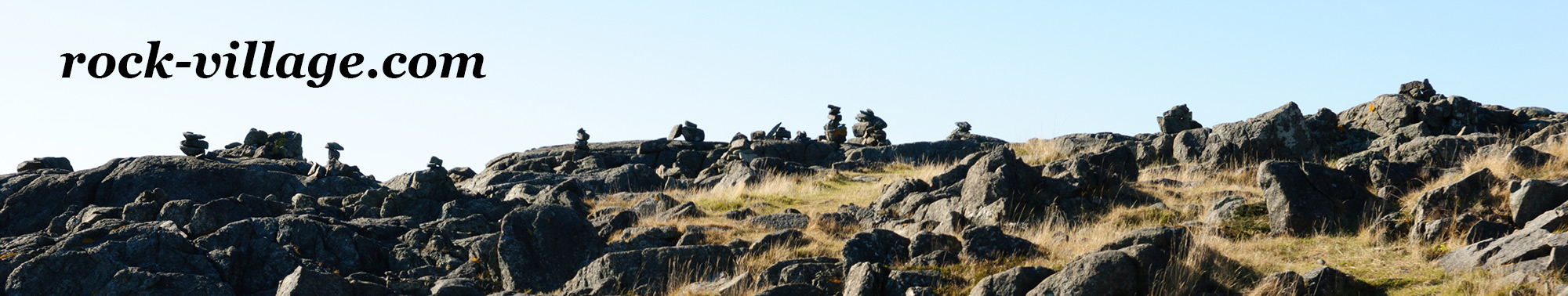 Rock Village Website banner picture, a rocky area with cairns