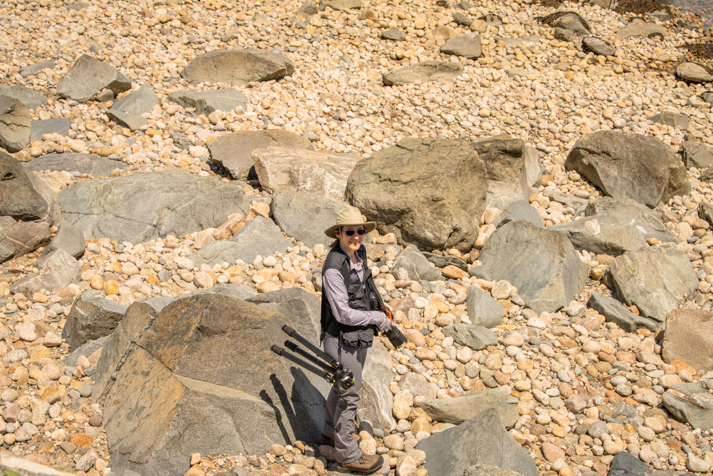 Anne with camera and gear on Allens Pond beach