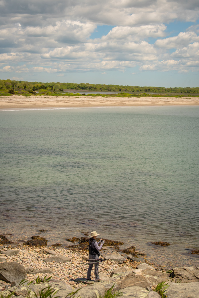 Anne with camera and gear on Allens Pond beach