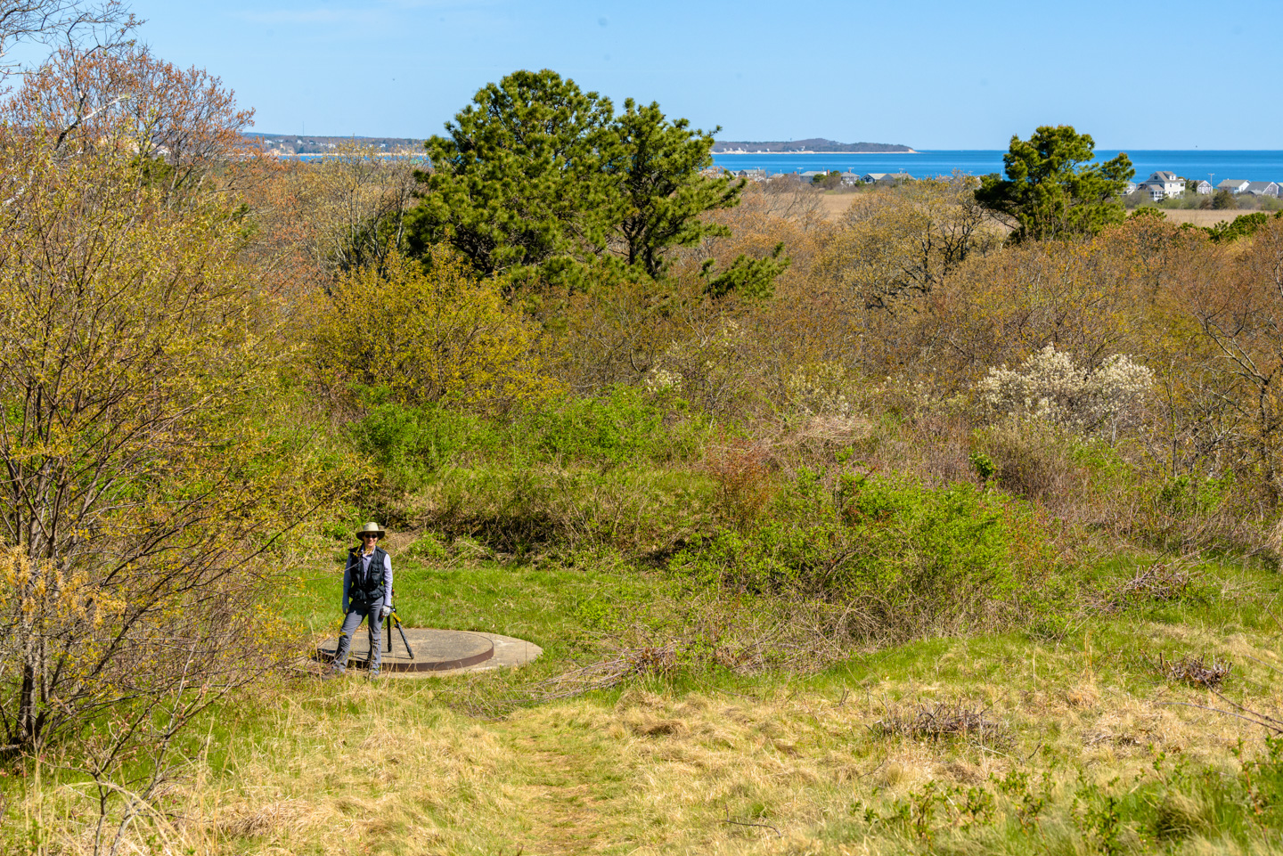 Anne standing next to a Panama Mount on Sagamore Hill in Scusset Beach State Reservation