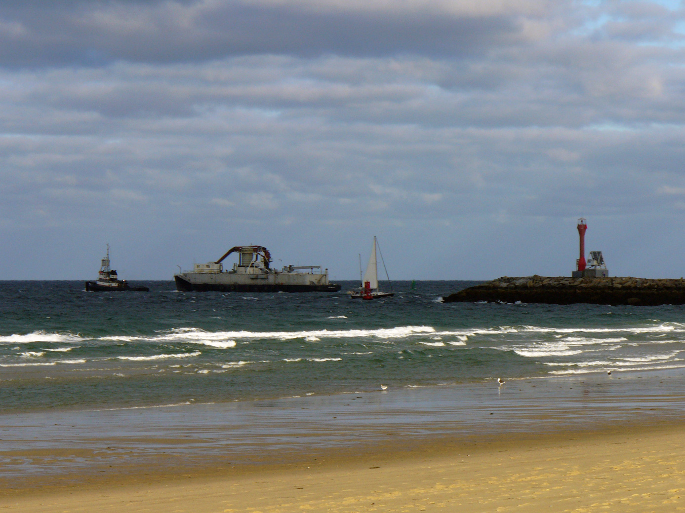 Tugboat and barge after having exited the Cape Cod Canal